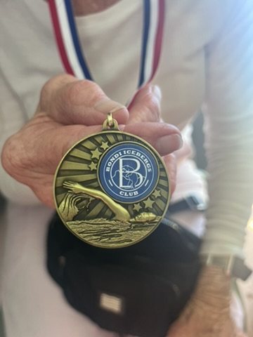 Peter holds his 2026 Bondi Icebergs championship medal