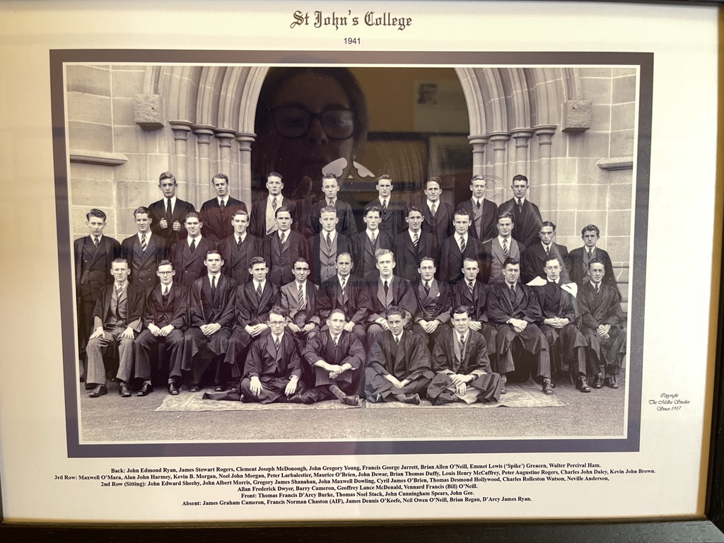 Framed 1941 group photograph of St John's College students, some in academic gowns