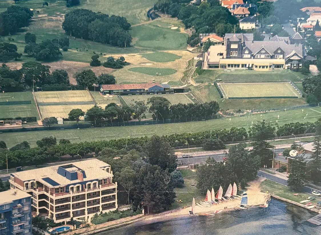 Aerial view of The Wintergarden apartment building on the harbour at Rose Bay