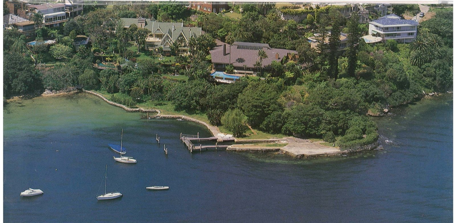 Aerial photograph of the harbourfront below 22D Vaucluse Road, with a private jetty and yachts moored offshore