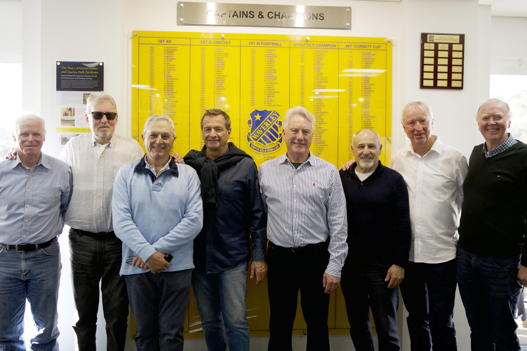 Peter Anderson with fellow Waverley old boys in front of the Captains and Champions honour board